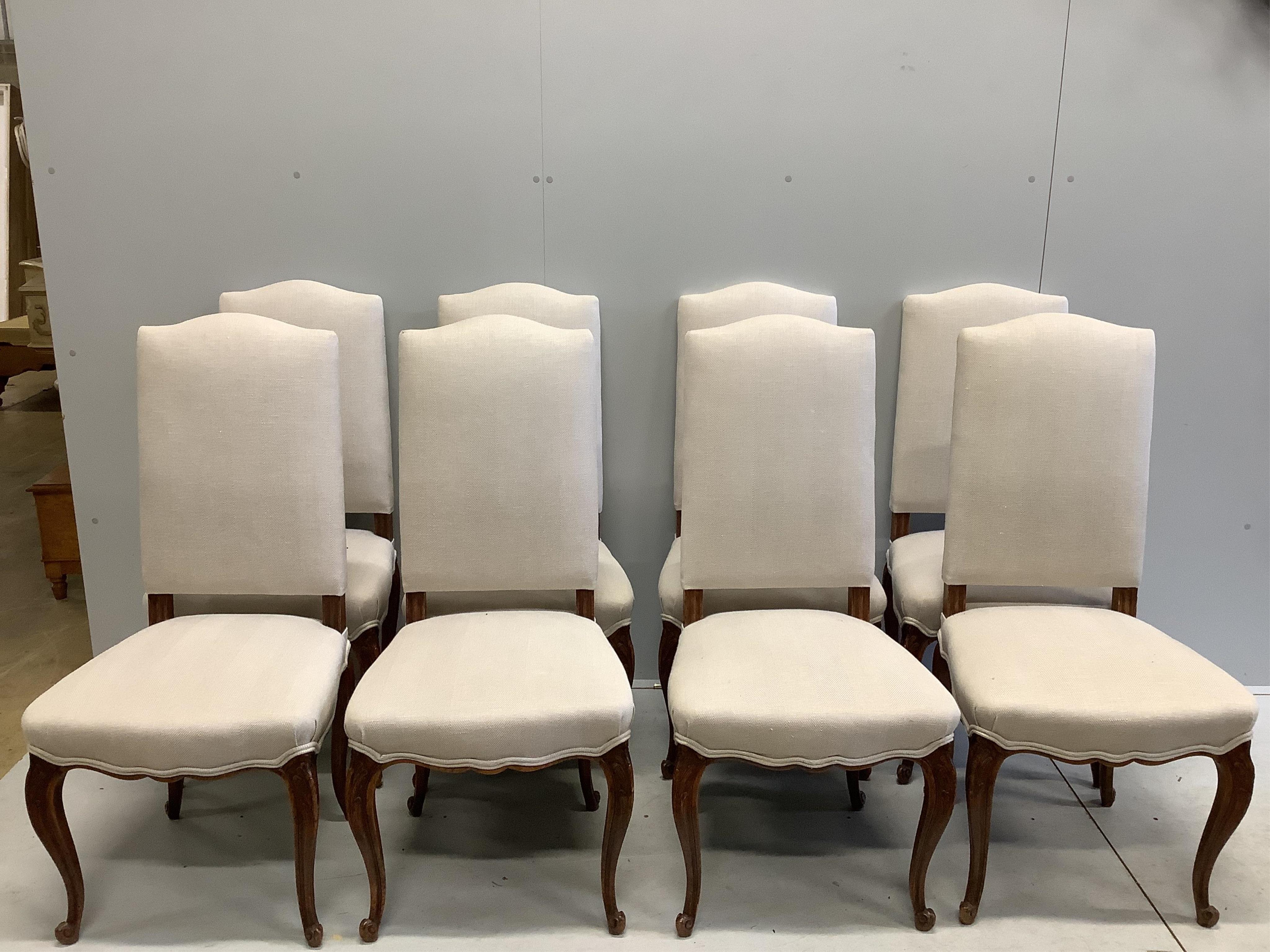 A set of eight 19th century French oak dining chairs, recently re-upholstered in a natural colour fabric, width 50cm, depth 46cm, height 106cm. Condition - good